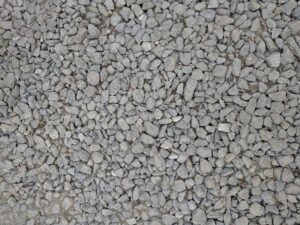 Textured close-up of grey gravel stones providing a natural rocky surface.