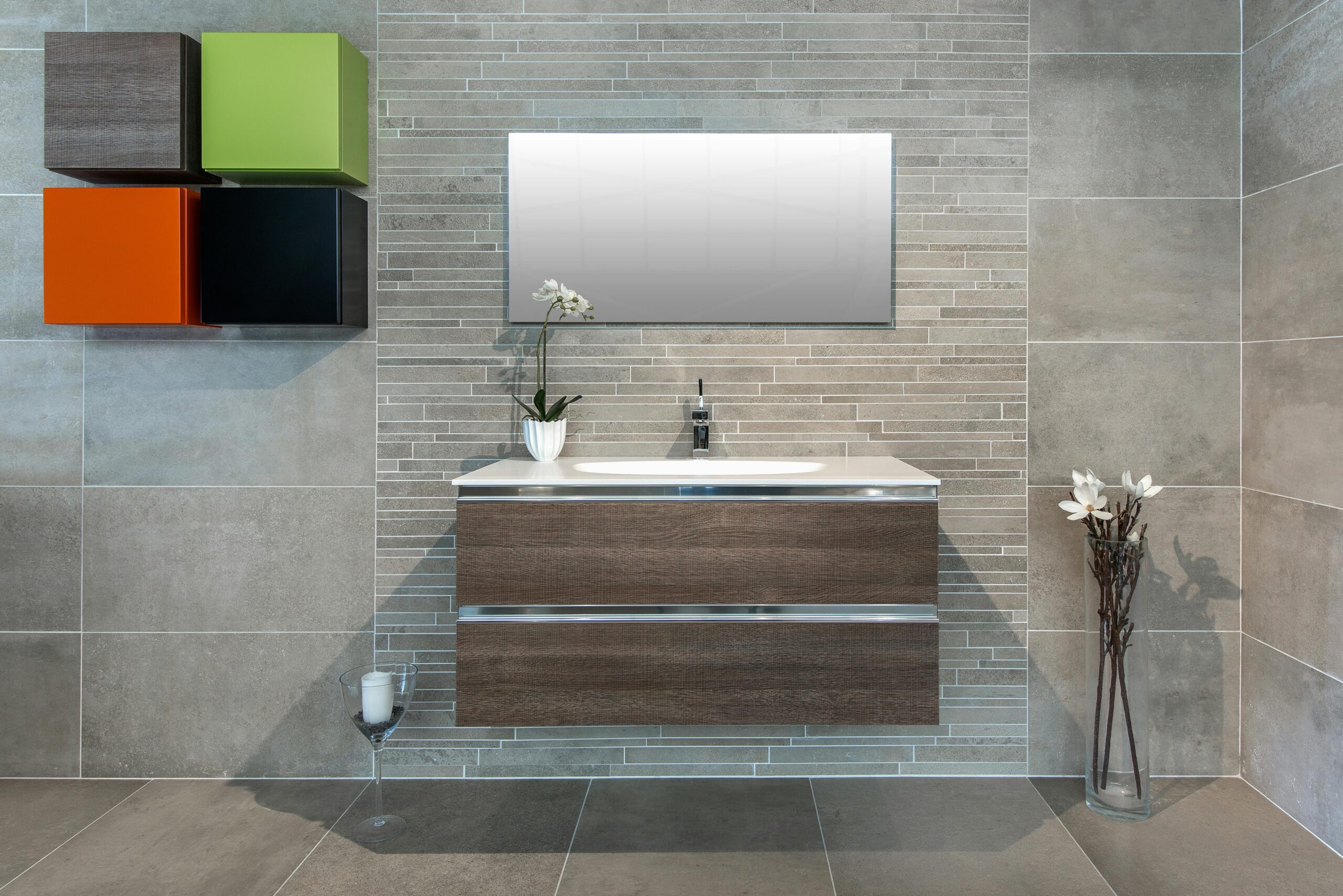 Elegant modern bathroom interior featuring minimalist design with floating vanity, mirror, and decorative wall shelves.
