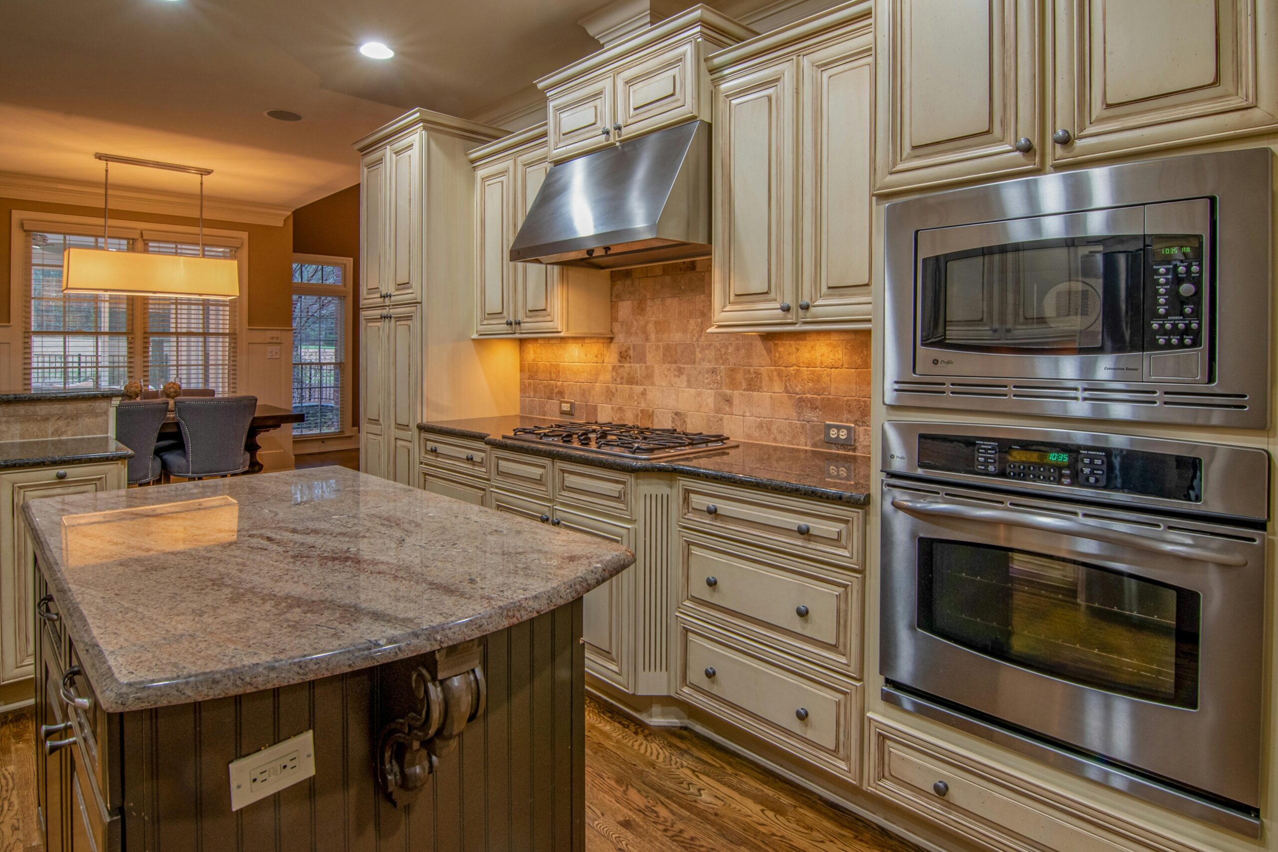 A stylish kitchen featuring stainless steel appliances and luxurious counter space.