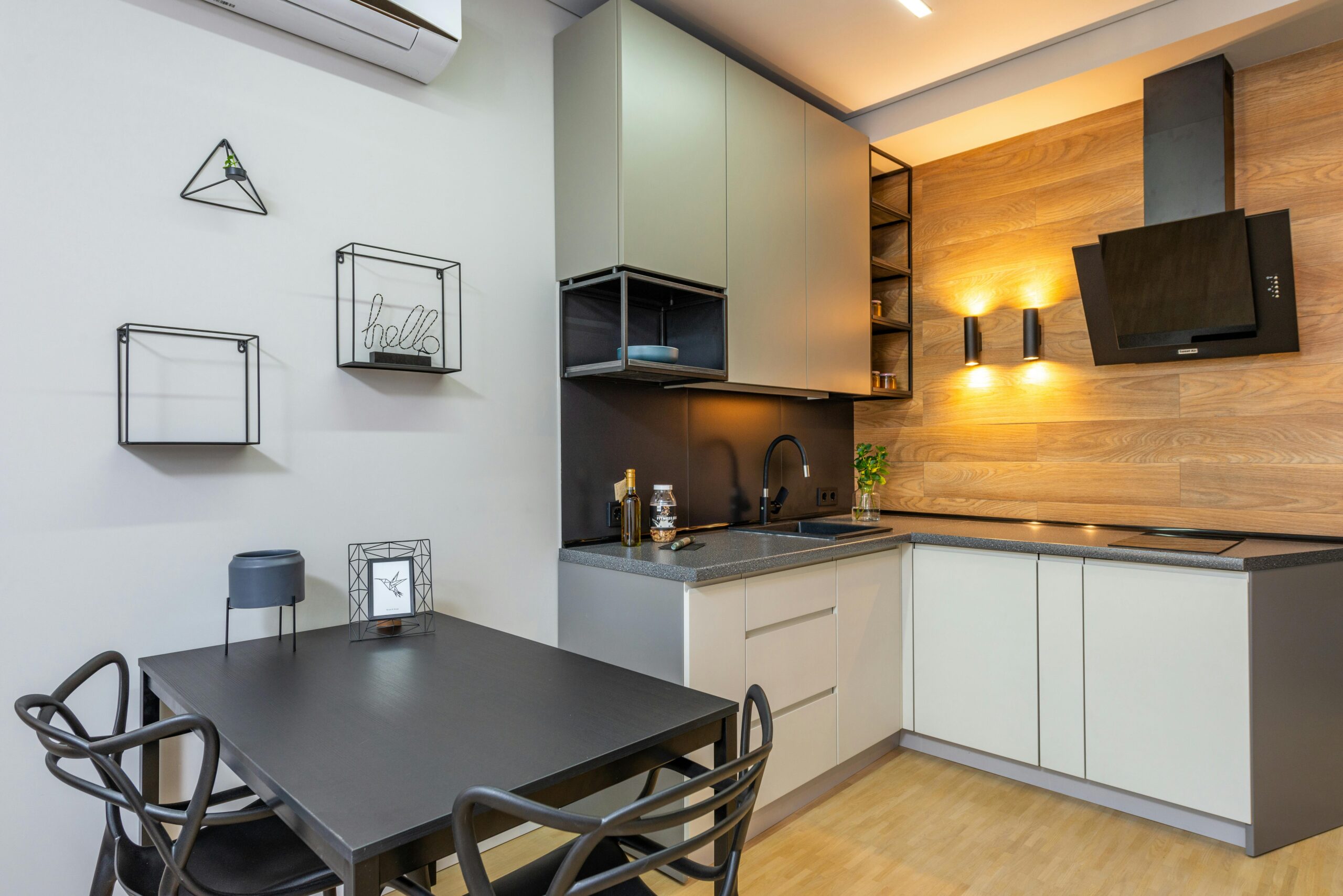 Stylish and modern kitchen interior with contemporary decor and lighting.