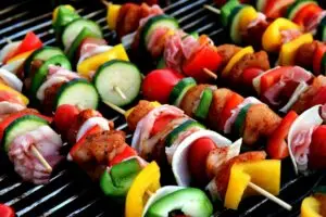 Freshly grilled colorful skewers with mixed vegetables and meat, perfect for a summer barbecue.